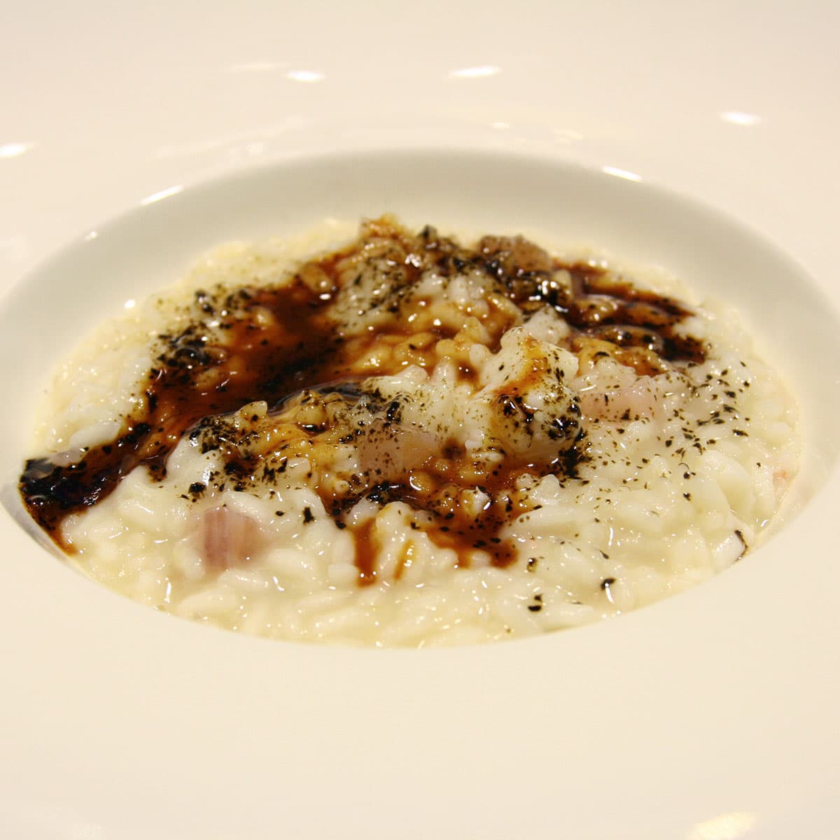Enoteca Pinchiorri Risotto nervetti, scampi e liquirizia