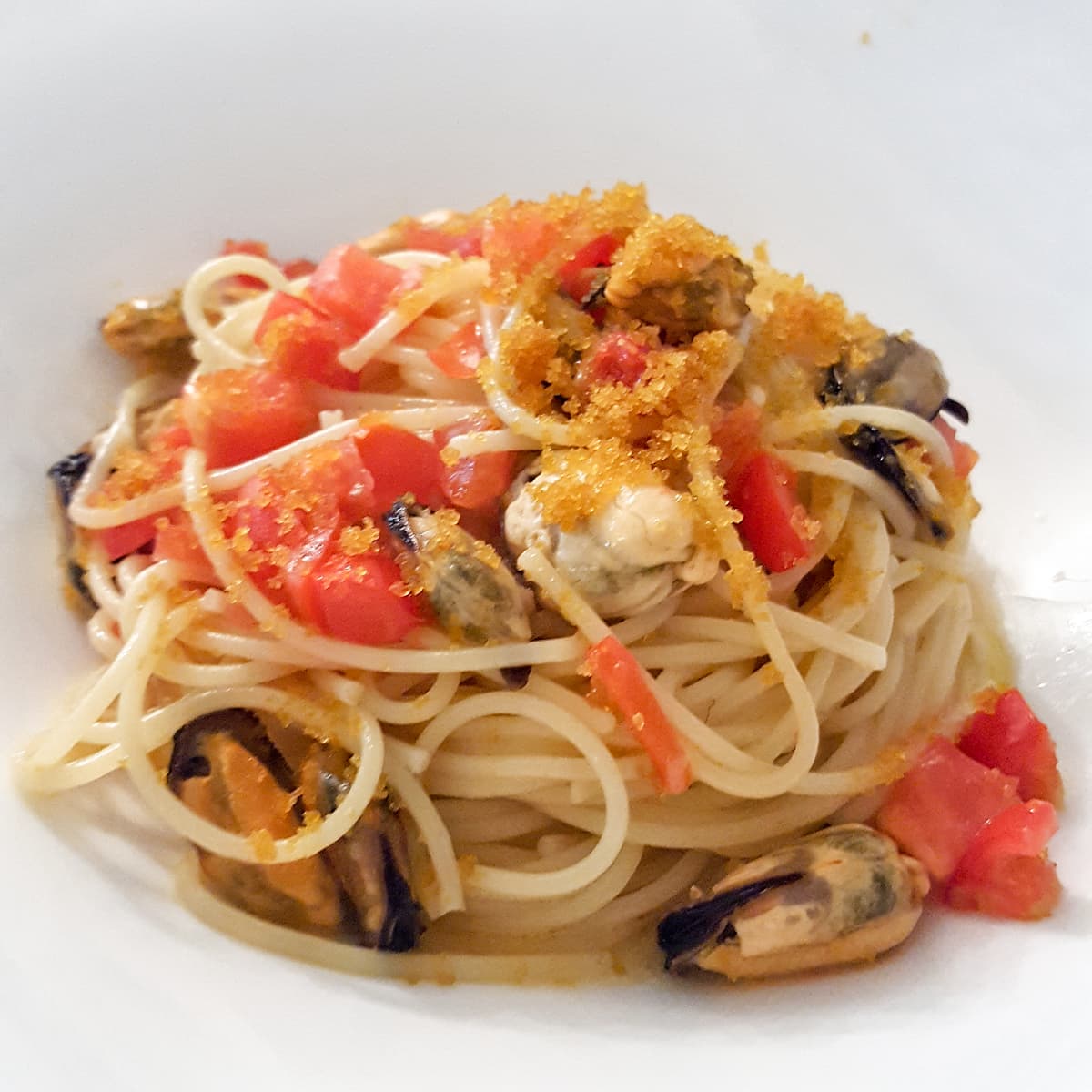 Spaghettini Carla Latini, pomodorini, cozze, bottarga